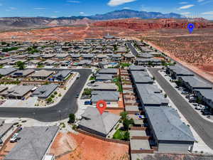 Aerial perspective of suburban area featuring a mountainous background