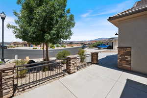 Covered porch featuring a mountain view and a residential view