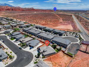 Aerial perspective of suburban area featuring a mountain backdrop