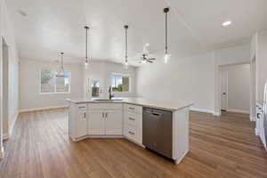 Kitchen featuring light wood finished floors, dishwasher, a ceiling fan, white cabinets, and recessed lighting