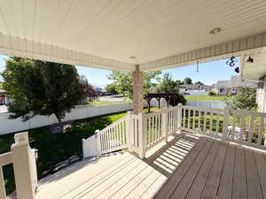 Deck with a residential view and a fenced backyard
