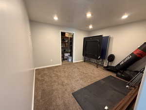 Workout area featuring recessed lighting and carpet floors