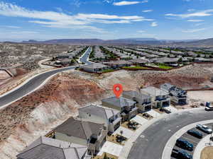 Aerial view of residential area with a mountainous background