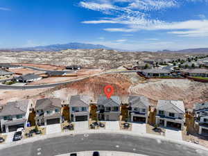 Aerial view of residential area featuring mountains