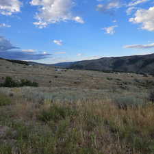 View of mountain background featuring rural landscape