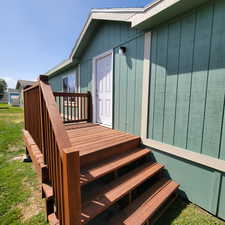 Wooden terrace featuring stairway