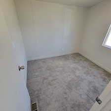 Empty room with carpet floors