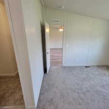 Unfurnished room with carpet flooring