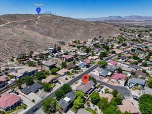 Aerial perspective of suburban area with a mountainous background