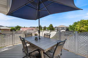 Wooden terrace featuring outdoor dining area