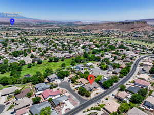 Aerial view of residential area featuring mountains