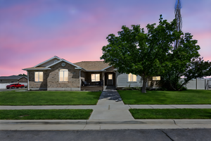 View of front of home featuring brick siding