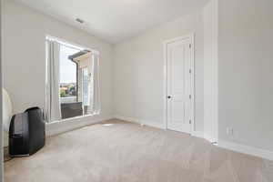 Unfurnished room with carpet flooring and baseboards