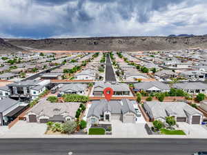 Aerial view of residential area featuring a mountain backdrop