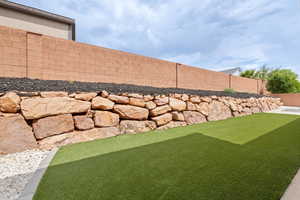 View of fenced backyard