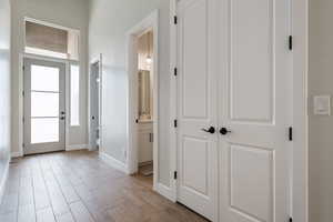 Entryway featuring baseboards and light wood-type flooring