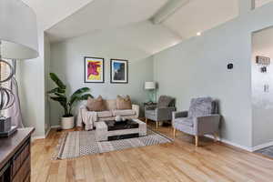 Living room with light wood finished floors and baseboards