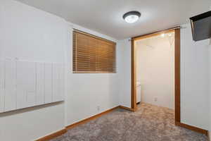 Unfurnished bedroom with carpet