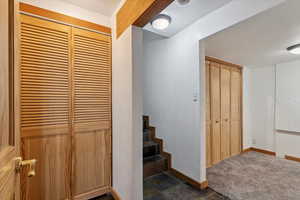 Staircase featuring baseboards