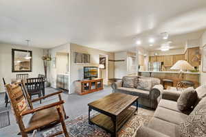 Living room featuring carpet and baseboards