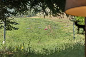 View of yard with a rural view