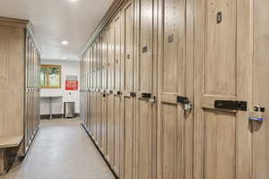 Hallway with baseboards and recessed lighting