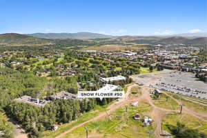Aerial view of property and surrounding area with mountains