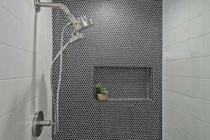 Bathroom view of a tile shower