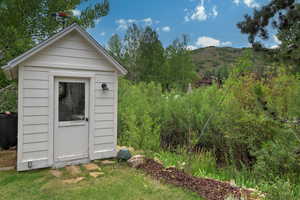 View of shed with a mountain view
