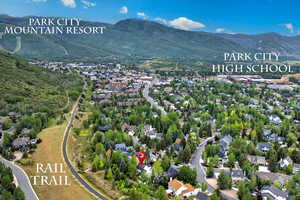 Aerial view of property and surrounding area with mountains