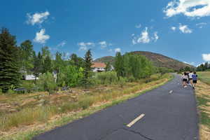 View of asphalt street with a mountain view