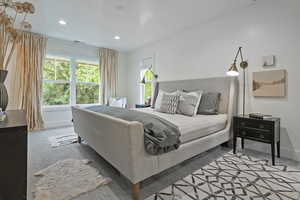 Bedroom with recessed lighting and baseboards