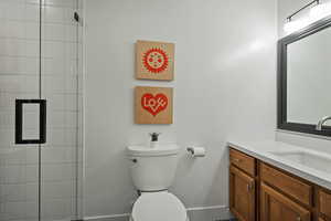 Full bathroom with vanity and a tile shower