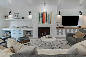 Living room with a large fireplace