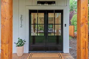 Property entrance featuring french doors