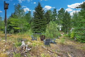 View of yard with a fire pit