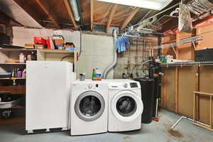 Washroom featuring washer and dryer