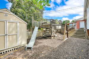 View of yard with a storage shed