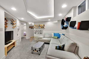Living room featuring carpet and recessed lighting