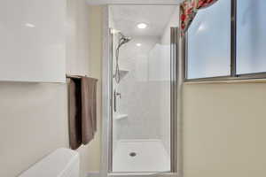 Bathroom featuring a shower stall