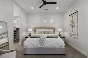 Bedroom with a walk in closet, recessed lighting, and ceiling fan