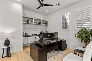 Office with a ceiling fan, light wood-style flooring, and recessed lighting