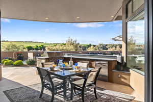 View of patio / terrace with area for grilling and outdoor dining area