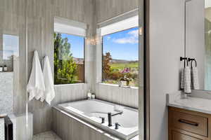 Full bath with a bath and vanity