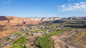 Aerial overview of property's location featuring a local golf course and nearby suburban area