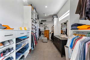 Spacious closet with carpet flooring