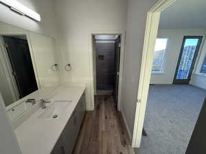 Bathroom featuring vanity and wood finished floors