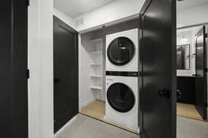 Laundry area with stacked washer / dryer