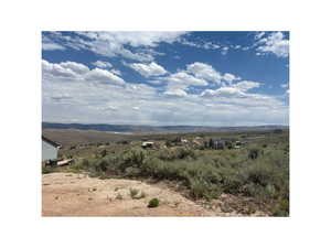 View of mountain background featuring rural landscape