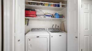Laundry area with washing machine and clothes dryer